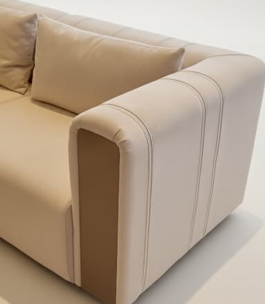 A close-up view of a modern sofa armrest and seat cushion. The sofa features clean lines, plush cushioning, and subtle stitching details. The armrest is upholstered in a light beige material with vertical decorative stitching and a contrasting darker beige accent panel on the side. A matching throw pillow is visible on the seat. — 3D model