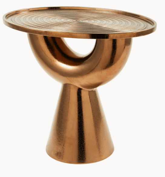 A striking end table with an abstract, sculptural design. It features a circular, flat top with concentric ridged detailing. The base is composed of a curved, hollow structure that transitions into a flared, conical pedestal. The metallic finish gives it a contemporary and luxurious appearance. — 3D model