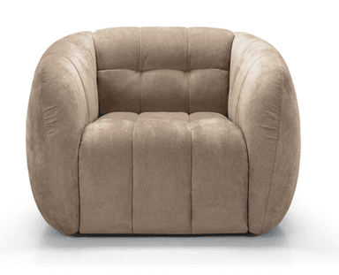 A single contemporary accent chair featuring a rounded, barrel-like silhouette. The chair is upholstered in a soft, beige velvet or velour fabric. It has distinct channel tufting on the arms and sides, which contributes to its plush appearance, and button tufting on the backrest. The base is recessed, giving the chair a floating effect. Its overall design emphasizes comfort and a modern aesthetic. — 3D model