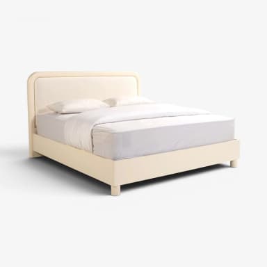 A modern low-profile upholstered platform bed featuring an off-white/cream fabric, a soft-edged headboard, and minimalist design. — 3D model