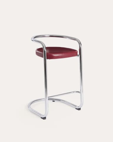 A high bar stool featuring a gleaming tubular chrome frame and a curved, red upholstered seat and backrest. The frame forms a continuous loop from the base, extending upwards to create armrests and a partial back support. The design is sleek and minimalist, characteristic of the Bauhaus and modernist aesthetic. — 3D model
