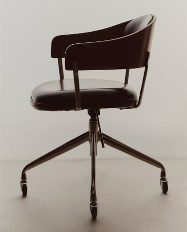 A brown leather upholstered swivel desk chair featuring a bentwood back shell and a five-star chrome caster base. — 3D model