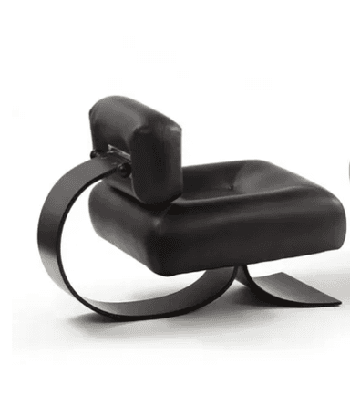 A modern armchair with a sculptural design. The seat and back are upholstered in black leather with deep tufting on the headrest. The base is made of curved, matte black metal elements that provide a unique, cantilevered appearance. — 3D model
