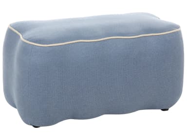 An organically shaped ottoman upholstered in a light blue textured fabric, featuring prominent cream-colored contrast piping along its top edge. The piece has a soft, curvilinear form suggesting a contemporary design aesthetic. — 3D model