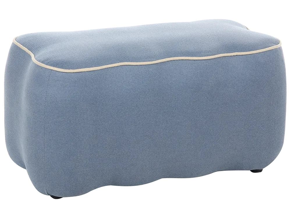 An organically shaped ottoman upholstered in a light blue textured fabric, featuring prominent cream-colored contrast piping along its top edge. The piece has a soft, curvilinear form suggesting a contemporary design aesthetic. — 3D model