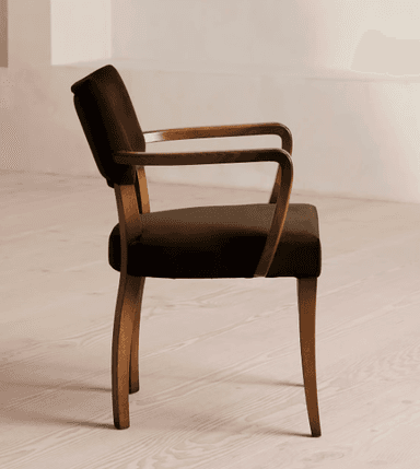 A wooden armchair with upholstered seat and backrest. The chair features curved armrests and four tapered legs. The upholstery is a dark brown fabric, and the wooden frame has a natural wood finish. — 3D model