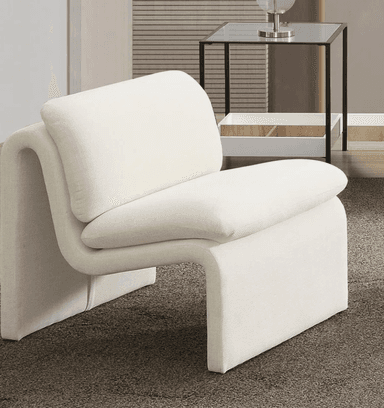 A contemporary armchair with a unique, sculptural design. It features a continuous, curved form that creates the seat, backrest, and armrests. The upholstery is a textured, light-colored fabric. The armchair appears to be a single, cohesive unit with no visible separate legs. — 3D model