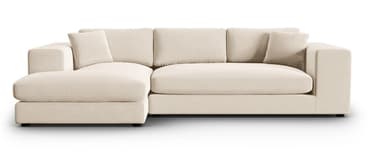 A sectional sofa with a chaise lounge extension. It features a low profile with clean lines and plush cushions. The sofa is upholstered in a light-colored fabric and includes several back cushions and two armrest pillows. — 3D model
