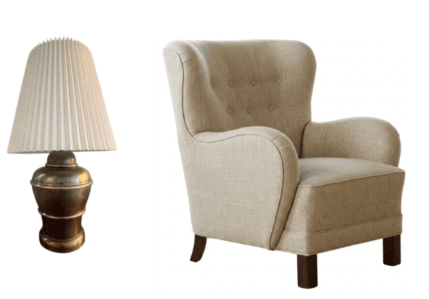 An upholstered wingback armchair featuring a high back with button tufting, rounded winged sides, and rolled arms. The chair is covered in a light beige or natural-toned textured fabric and stands on four dark, square-tapered wooden legs. — 3D model