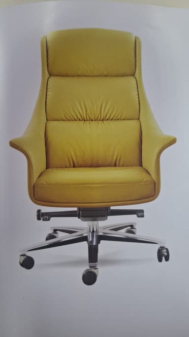 A high-back swivel office chair upholstered in mustard yellow faux leather, featuring a padded backrest and seat, integrated armrests, and a polished chrome five-star base with casters. — 3D model