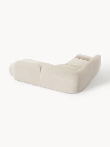 A contemporary modular sectional sofa featuring soft, rounded forms and upholstered in a light-colored, textured fabric. The configuration includes a two-seat section, a corner piece, and an integrated ottoman/chaise extension, creating an L-shaped layout with a low profile. — 3D model