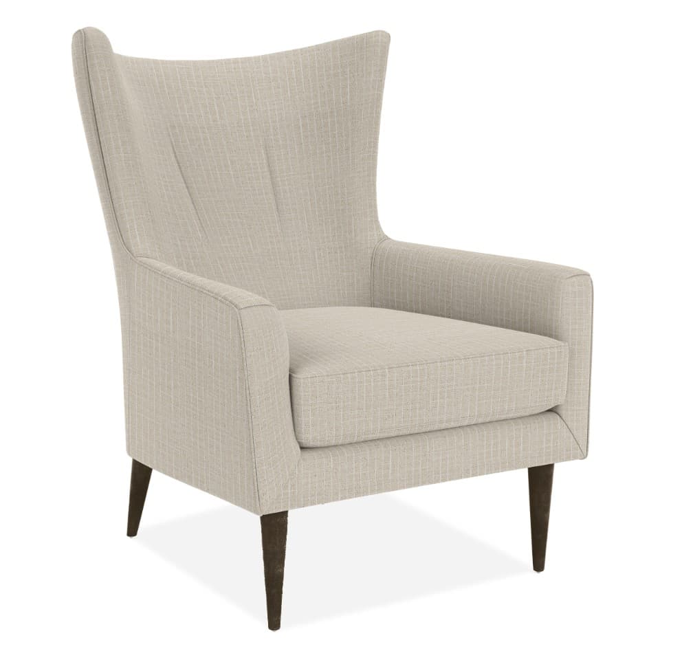 A modern upholstered armchair featuring a high back, integrated armrests, a single seat cushion, and slender, tapered dark wood legs. The upholstery is a light beige, textured fabric. — 3D model