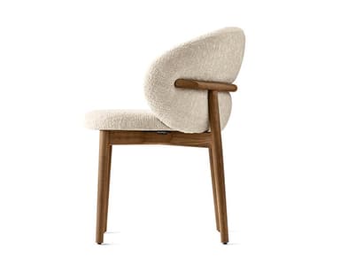 Two modern upholstered chairs with curved backs and wooden frames. The chairs feature a light-colored, textured fabric upholstery for the seat and backrest, and a dark-stained wooden structure for the legs and curved back support element. — 3D model