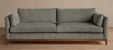 A contemporary two-seater sofa featuring gray fabric upholstery, loose seat and back cushions, and a visible wooden frame base with tapered legs. — 3D model