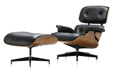 A classic Mid-Century Modern Eames Lounge Chair and Ottoman set, featuring black leather upholstery on molded plywood shells with a dark wood veneer. The chair has a distinctive reclining form with separate back and seat cushions, integrated armrests, and rests on a five-star swivel base. The matching ottoman has a similar molded plywood shell, black leather cushion, and a four-star fixed base. — 3D model
