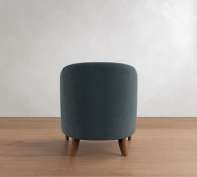 A blue-grey upholstered barrel-back accent chair with exposed dark wood trim and turned legs, featuring a curved silhouette and textured fabric. — 3D model