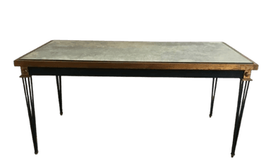 A rectangular coffee table featuring an antiqued, mottled mirror top set within a slender, gilded metal frame. The table stands on four clusters of splayed, thin black metal legs that taper slightly, with small gilded decorative elements at the top connection points and at the feet. — 3D model