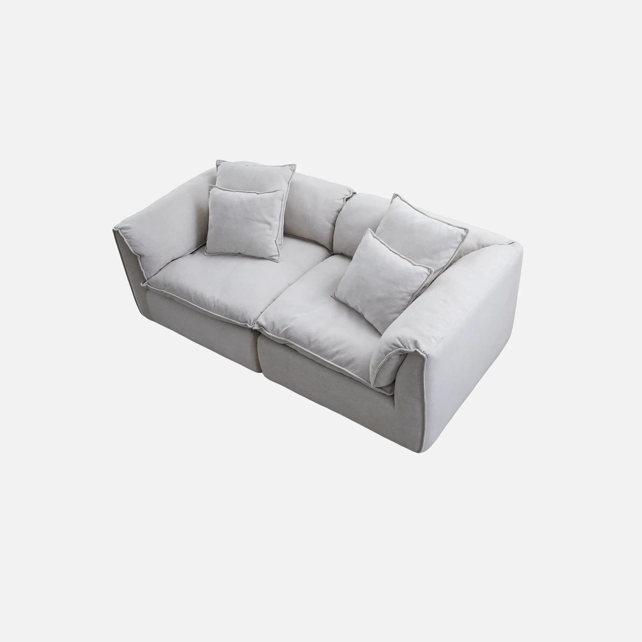A modern two-seater loveseat with light grey fabric upholstery, featuring deep, plush cushions, square arms, and visible piping details. It includes multiple loose back cushions and additional throw pillows. — 3D model
