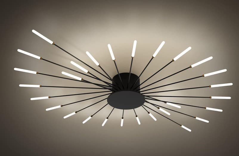 A contemporary Sputnik-style chandelier featuring a central black matte base from which numerous slender black metal arms radiate outwards. Each arm terminates in a small brass accent and holds a frosted cylindrical light diffuser. The design evokes a starburst or atomic aesthetic, combining modern and mid-century influences. — 3D model