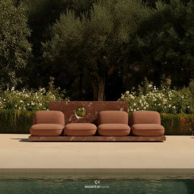A modular bench unit featuring a tiered marble base supporting upholstered seating modules. The base is composed of a flat, rectangular platform and a vertical slab with a circular cutout. Four individual seating elements, each with a distinct cushioned seat and backrest, are arranged linearly on the platform. The marble exhibits a rich reddish-brown hue with white veining. The upholstery is a textured, woven fabric in a warm brown tone. — 3D model
