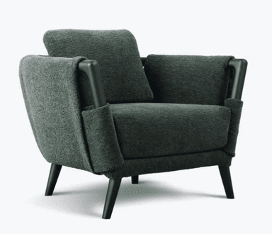 A contemporary armchair with a fabric-covered frame, featuring a textured weave. It has a prominent wooden frame visible at the arms and back, with tapered wooden legs. A square throw pillow rests on the seat. — 3D model