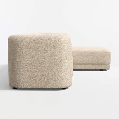 A sectional sofa with a chaise lounge attachment. The sofa features rounded armrests and a low profile design. It is upholstered in a textured fabric with a speckled pattern. The base is a dark, flat plinth or low legs. — 3D model