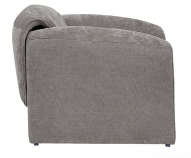 A contemporary armchair with a sculpted, flowing design. The chair features a deep, comfortable seat and a high back that curves into integrated armrests. The base is formed by two substantial, curved legs that extend from the seat structure, providing a unique silhouette. The upholstery appears to be a textured fabric. — 3D model