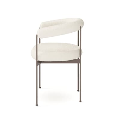 A modern armchair featuring an off-white boucle upholstered seat and a continuous, curved, padded backrest that flows into armrests. The chair is supported by a sleek, dark metal frame with four slender, slightly splayed legs. — 3D model