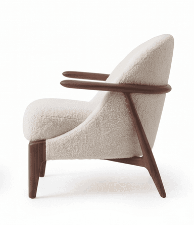 A contemporary armchair featuring an exposed dark wood frame with a curved backrest and integrated armrests. The seat and back are generously upholstered in a cream or off-white boucle fabric, providing a textured and plush appearance. The legs are tapered and splayed, contributing to an elegant and lightweight silhouette. — 3D model