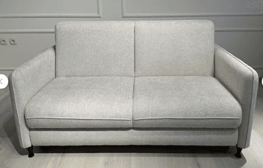 A modern two-seater sofa, also known as a loveseat, upholstered in a light gray textured fabric, featuring clean lines, removable back and seat cushions, and supported by small, dark, tapered legs. — 3D model