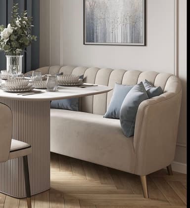 A contemporary loveseat featuring a distinctive fluted backrest, upholstered in a neutral beige fabric, and supported by tapered gold-toned legs, complete with light blue accent pillows. — 3D model