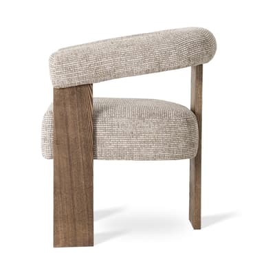 A modern armchair featuring a rounded, upholstered back and armrests that curve forward, supported by thick, rectangular wooden legs. The upholstery has a textured weave pattern. The wooden frame has a visible grain and a matte finish. — 3D model