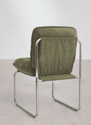 A modern cantilever chair featuring a continuous tubular chrome frame and light beige, textured bouclé-like fabric upholstery. The chair includes separate, plush seat and back cushions, with the backrest adorned with subtle button tufting. Its armless design and standard seat height make it suitable for dining or as an accent piece. Dimensions are provided, with an overall height of 87 cm and a seat height of approximately 50 cm. — 3D model
