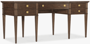 A dark brown wooden desk featuring a rectangular top, multiple drawers, and reeded tapered legs. The desk has a central knee space, flanked by two sections each containing two stacked drawers. Above the knee space, there is a single, shallower drawer. All drawers are fitted with square brass pulls featuring an etched geometric pattern. The reeded texture is present on the vertical elements of the frame and the tapered legs, adding a classical detail to the transitional design. — 3D model