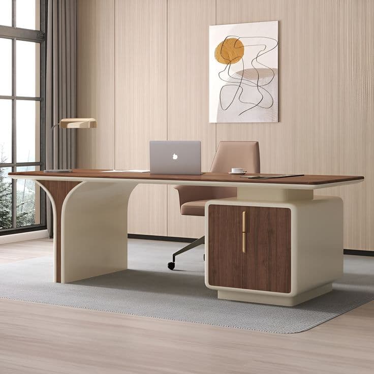 A modern executive desk featuring a dark wood-grain tabletop with rounded edges. One end is supported by a curved, cream-colored panel, while the other end rests on a rectangular storage cabinet of the same cream color. The storage cabinet has a single door or drawer front matching the dark wood grain of the tabletop, accented with a subtle, vertical gold-toned handle. — 3D model