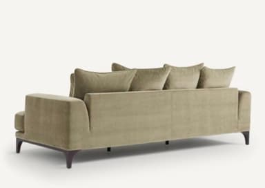A contemporary sofa with a plush, upholstered finish. It features a three-seat configuration with deep cushions and multiple throw pillows for added comfort. The sofa is supported by dark, tapered legs, suggesting a modern or mid-century modern aesthetic. The upholstery appears to have a soft texture, possibly velvet or a similar fabric. — 3D model