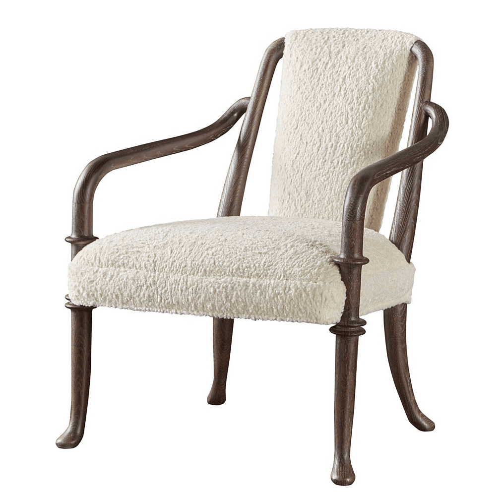 A comfortable armchair with a wooden frame and upholstered seat and back. The upholstery has a textured, boucle-like finish. The wooden frame features curved arms and turned details on the legs and arm supports. — 3D model