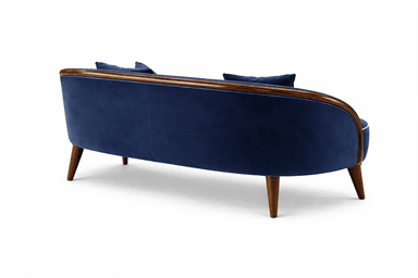 A mid-century modern-inspired sofa upholstered in a deep navy blue velvet fabric. It features a gently curved wooden frame, particularly noticeable at the arms and backrest, with a polished wood finish. The sofa is accented with white piping along the edges of the seat cushions, arms, and back. It includes two seat cushions and two back cushions, with two decorative throw pillows placed on top. The sofa is supported by four tapered wooden legs with metal caps at the feet. — 3D model