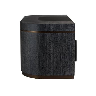 A modern executive desk with a dark, textured finish and curved pedestal bases. It features a rectangular top with a slight curve at the front and a recessed area near the back. The pedestal bases have metallic trim near the top and bottom, adding a decorative element. The overall design is contemporary and sleek. — 3D model