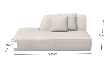 An off-white or light beige upholstered chaise lounge module, designed with a low profile and a clean, modern aesthetic. It features a tapered, angled backrest on one side and includes a single square throw pillow. The upholstery appears to be a textured fabric, and the overall form is minimalist with soft, rounded edges, suggesting comfort and contemporary design. It is depicted against a plain white background, highlighting its form. — 3D model