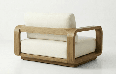 A modern armchair with a distinctive rounded wooden frame and upholstered seat and back cushions. The armchair features a low profile and wide arms with a smooth, curved finish. The base is a solid wooden platform that supports the entire structure. — 3D model