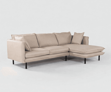 A modern sectional sofa with an integrated chaise lounge, upholstered in a light beige textured fabric, supported by slender black metal legs. — 3D model