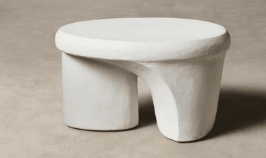 An off-white sculptural table with a rounded top and a distinctive, asymmetrical, and curved base, featuring a textured finish. — 3D model