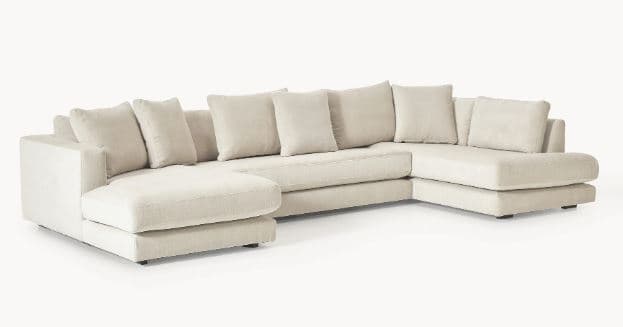 A large, sectional sofa with a U-shaped configuration. It features deep seating with multiple plush cushions for both the back and seat. The sofa includes two chaise lounge sections, one on each end of the U-shape. The upholstery appears to be a textured fabric. — 3D model