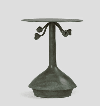 A small, round, pedestal accent table crafted from patinated bronze, featuring a distinctive single column base and organic, botanical-inspired elements beneath the tabletop. — 3D model