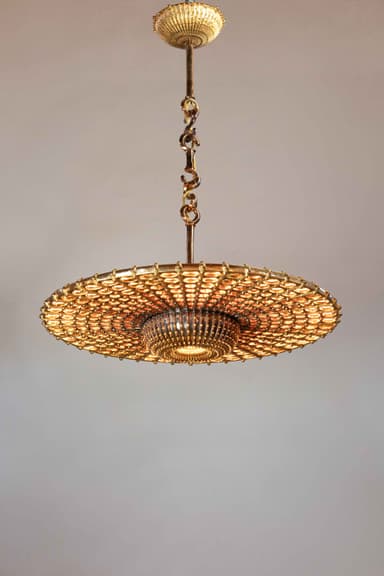 A highly ornate ceiling-mounted chandelier featuring a gold-toned metal construction. It consists of a central, dome-shaped body surrounded by a wide, flat, circular ring, reminiscent of Saturn. Both the central body and the ring are densely embellished with numerous small, reflective elements, likely crystals or glass beads, which create a shimmering effect. The chandelier is suspended from the ceiling by a decorative link chain and a central rod, attached to an ornate ceiling canopy. — 3D model