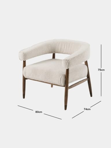 A contemporary upholstered accent armchair featuring a rounded backrest and seat, both covered in a plush, textured off-white bouclé fabric. The frame and legs are constructed from dark-stained solid wood, with the legs tapering downwards, ending in subtle foot caps. The armrests are integrated into the continuous curve of the backrest, providing a comfortable and inviting silhouette. — 3D model