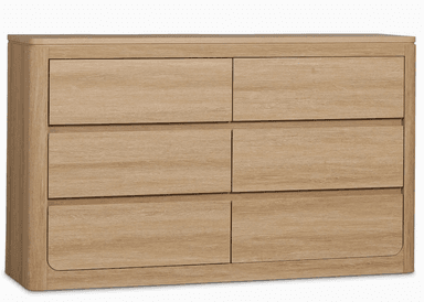 A dresser with six drawers arranged in two columns of three. The dresser has a light wood grain finish and rounded edges on the sides and the top surface. It appears to be a freestanding unit. — 3D model