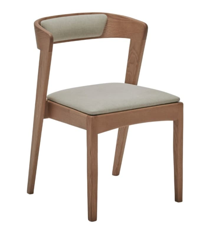A modern dining chair constructed from light-toned wood, likely oak, featuring a curved backrest and a square seat. Both the backrest and seat are upholstered with a light, neutral-colored fabric. The chair exhibits a minimalist design with clean lines, subtly splayed rear legs, and straight front legs, offering both comfort and contemporary aesthetic appeal. — 3D model