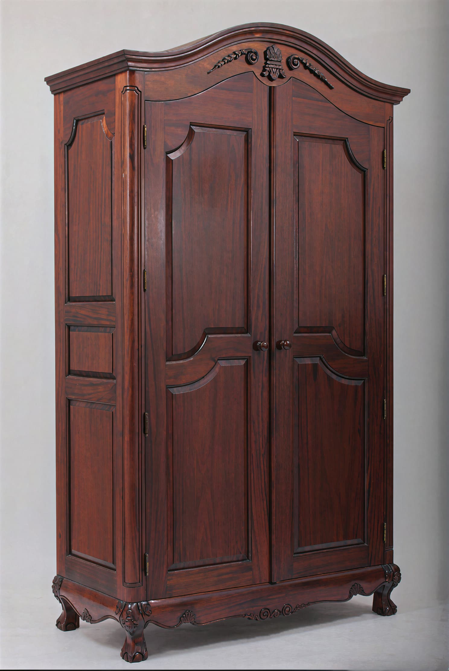 A dark reddish-brown wooden armoire, featuring a curved pediment with ornate carvings, double paneled doors, and a scalloped base with cabriole-style feet, indicative of French Provincial or Baroque design. — 3D model
